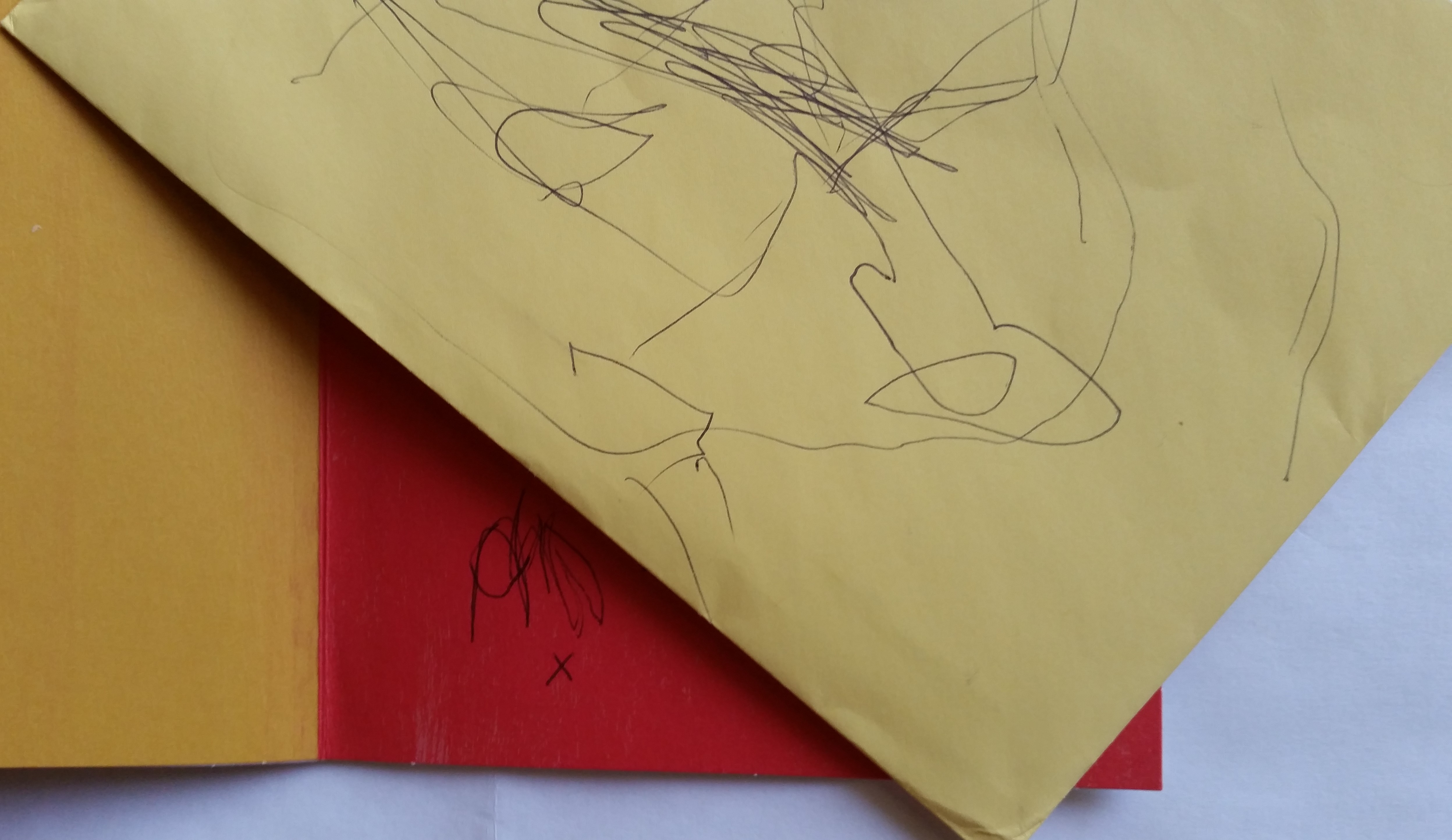 An example of a child's early scribbles on paper