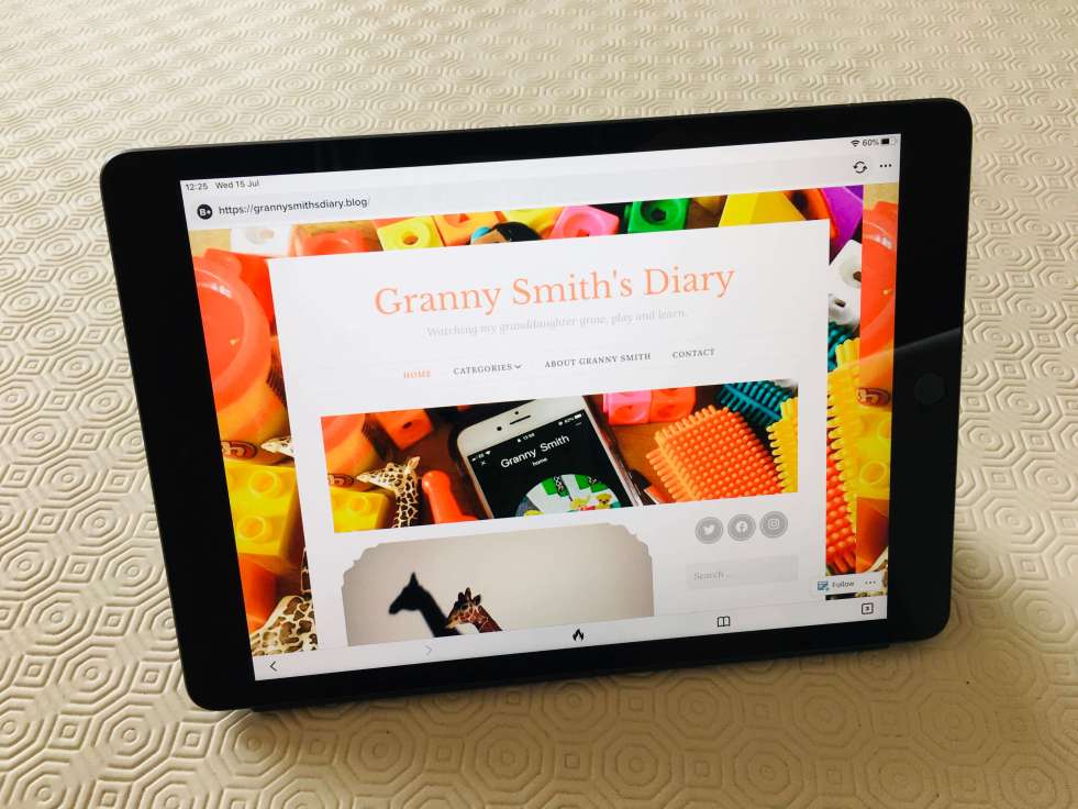 An iPad tablet computer, displaying the Granny Smith's Diary homepage on the screen