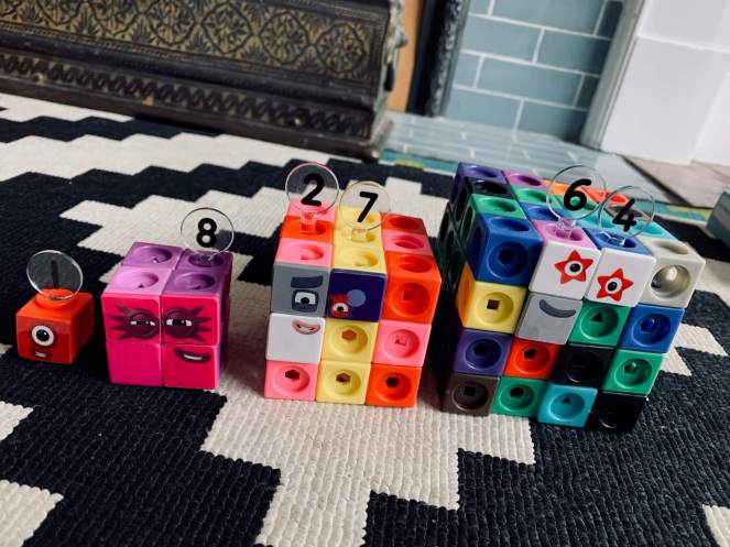 A set of Numberblocks Mathlink cubes arranged into a set of supercubes - 1, 8, 27, 64