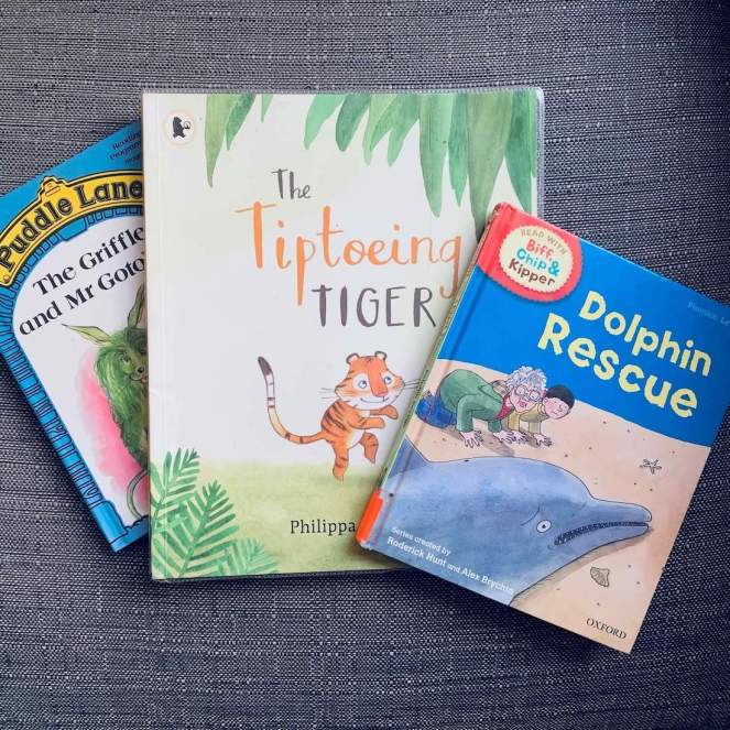 Three books ideal for a young reader: Dolphin Rescue (from the Biff, Chip & Kipper series), The Tiptoeing Tiger by Philippa Leathers and The Griffle and Mr Gotobed (from the Puddle Lane series)