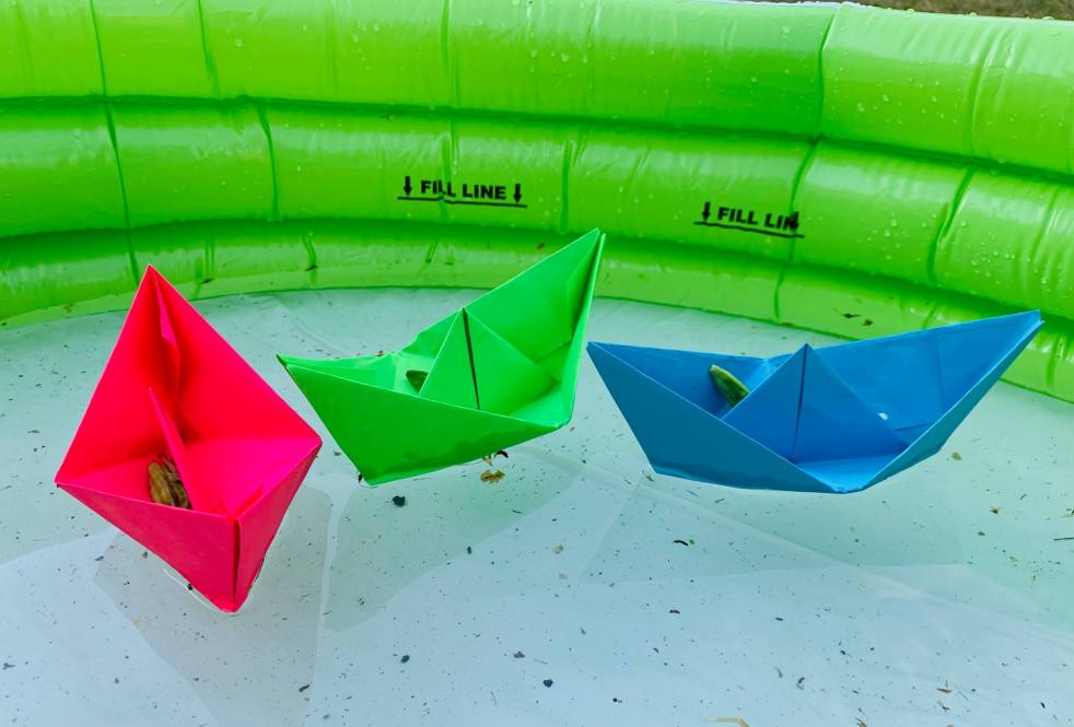 Paper boats used to illustrate a STEM exercise